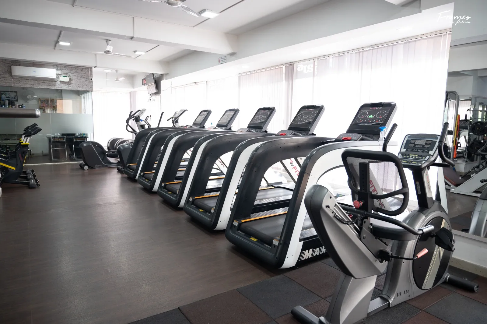 Cardio equipment and treadmills inside Power Fitness Club in Hennur.